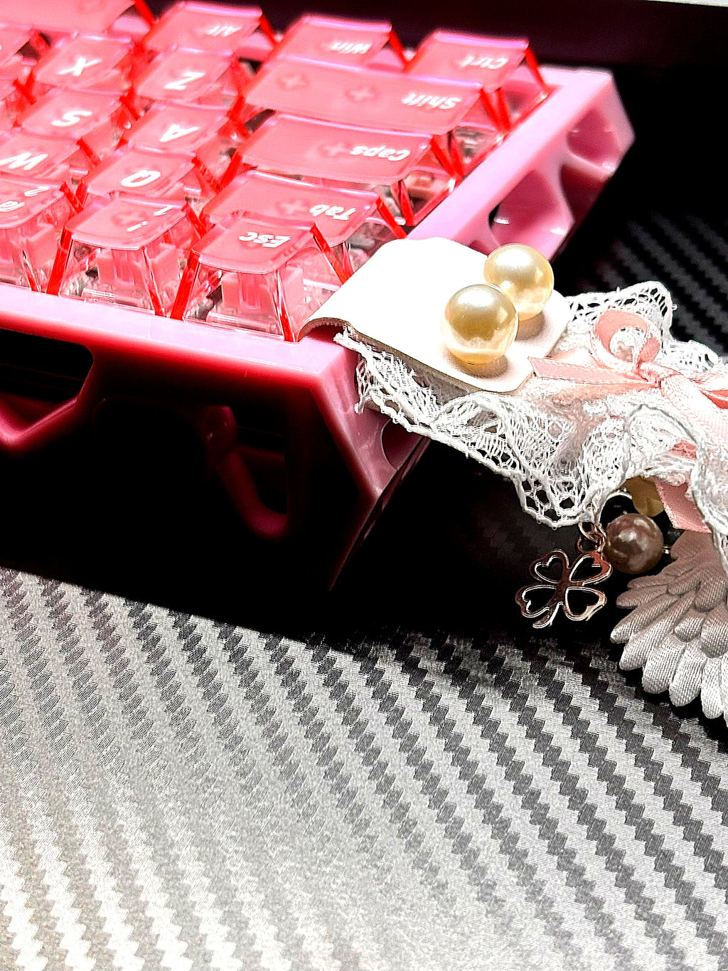 Frosted translucent pink keycaps with white jelly spares