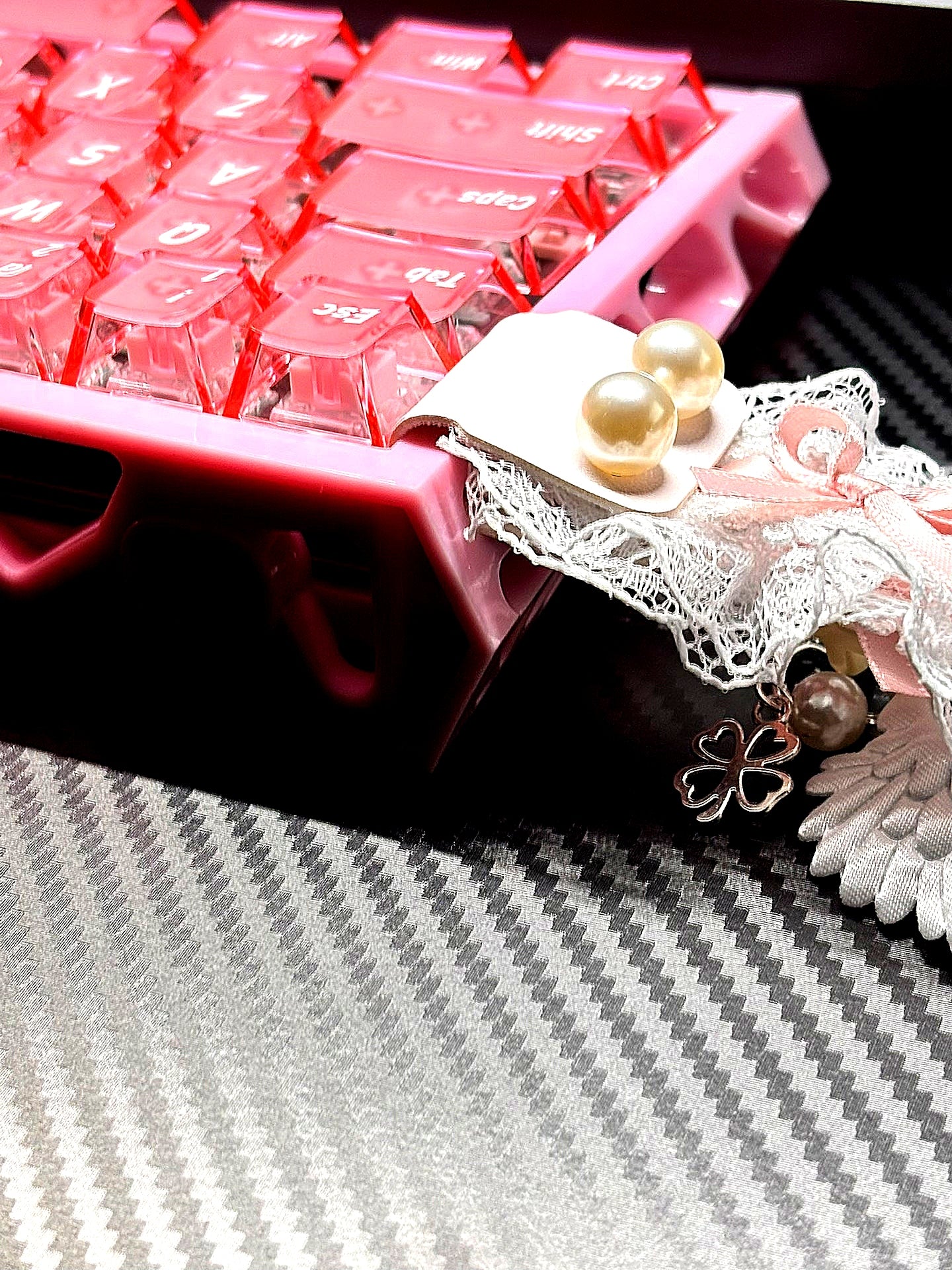 Frosted translucent pink keycaps with white jelly spares