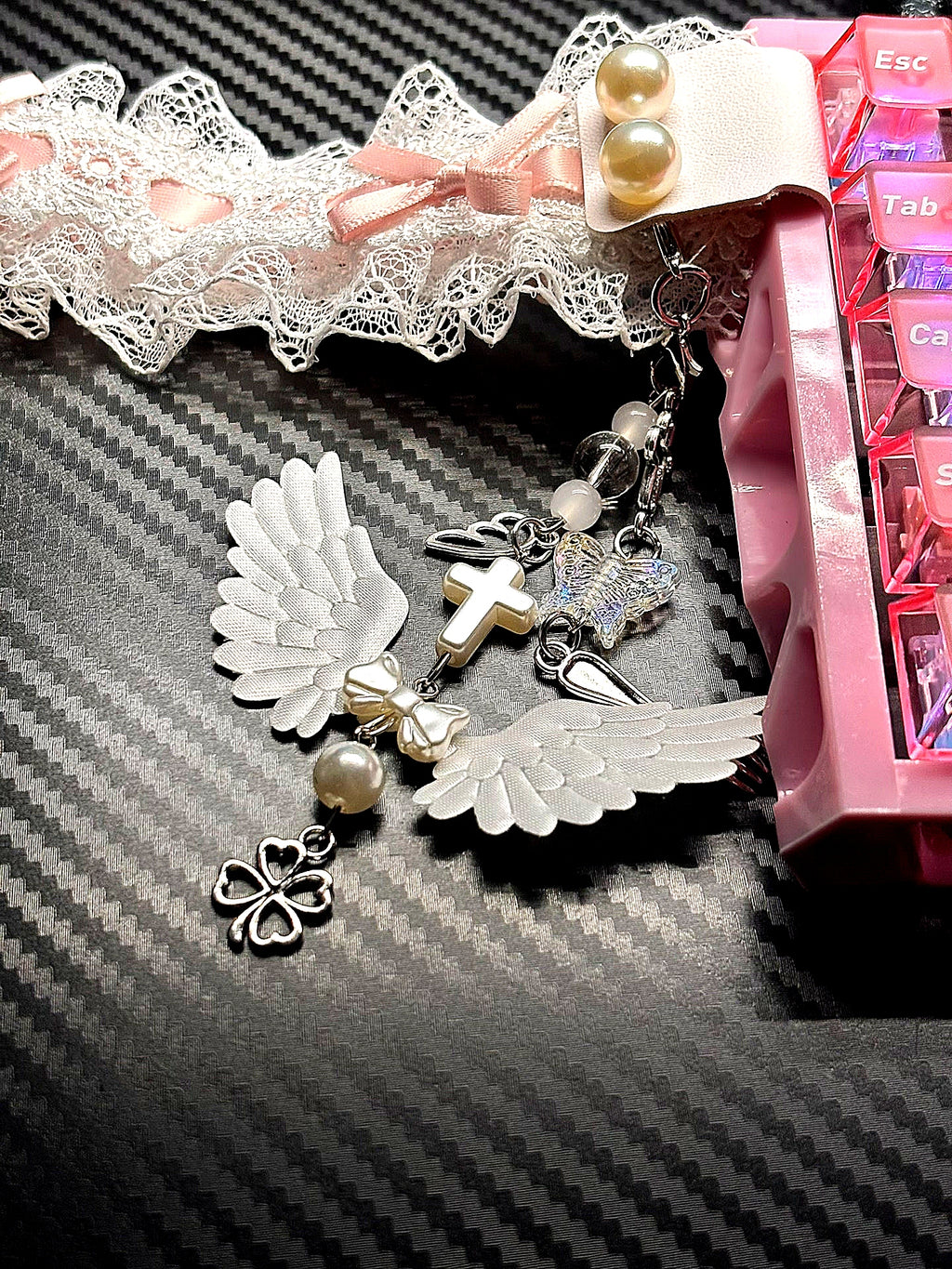 Custom angel wing ribbon decoration on keyboard